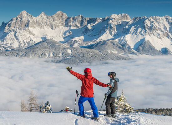 Wonderful view above the clouds with the Dachstein panorama